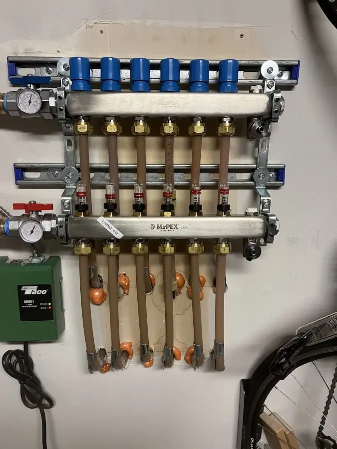 Plumber performing Water Heater Repair at a residential property in Summit